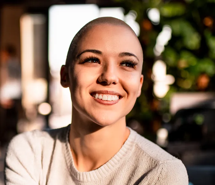 smiling woman with short hair laughing