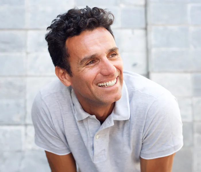 Close up portrait of a laughing older man